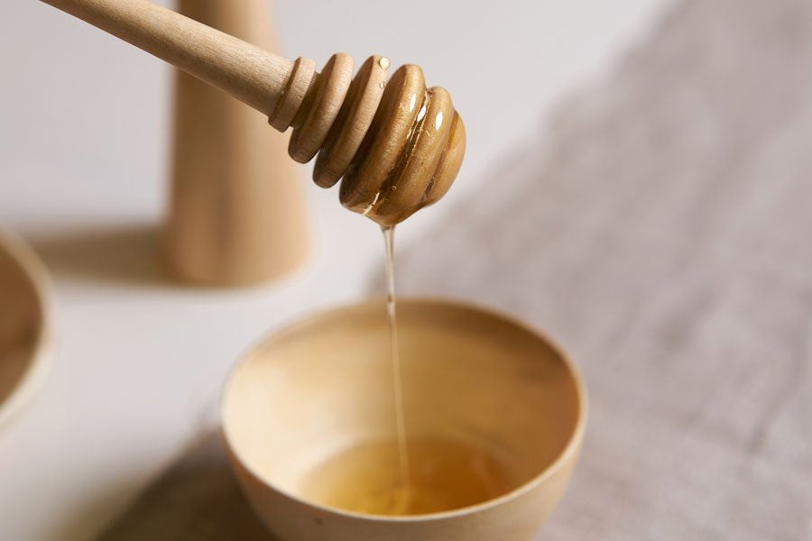 Cucchiaio per il miele in legno